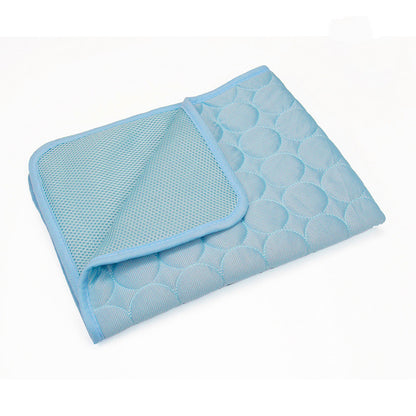 Self-cooling pet mat in Light Blue, folded to show quilted top and breathable mesh underside