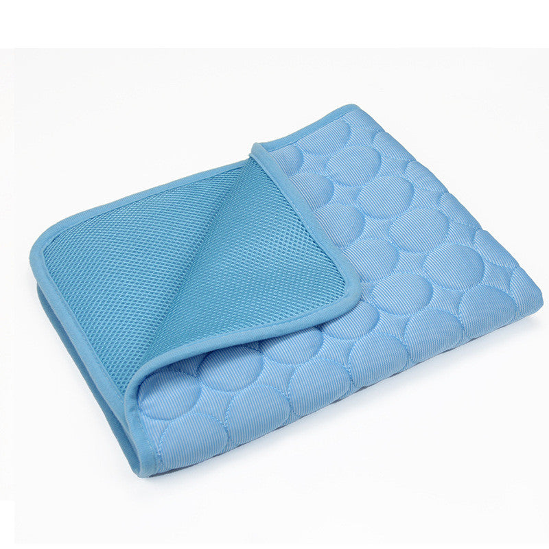 Self-cooling pet mat in Blue, folded to show quilted top and breathable mesh underside