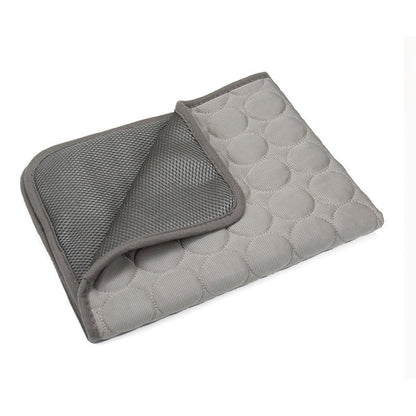 Self-cooling pet mat in Grey, folded to show quilted top and breathable mesh underside