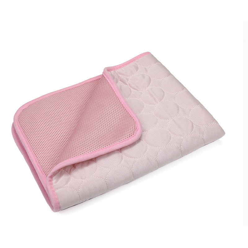 Self-cooling pet mat in Pink, folded to show quilted top and breathable mesh underside